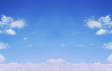 Cloudy blue sky background. Empty sky texture with small clouds. Sunny day high horizon view 