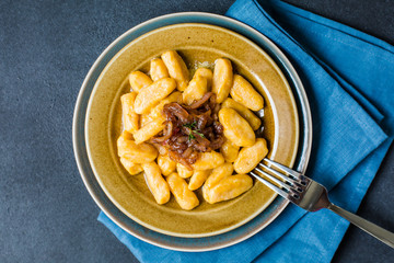 Homemade Gnocchi - dumplings made from potato and pumpkin, with caramelised onion and butter sauce.