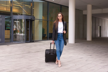 Full length shot of young businesswoman going to business travel