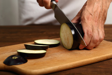 Cooking eggplant. Cutting.
