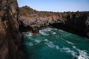 Fototapeta na wymiar Los Hervideros sight with volcanic rocks and wild sea on Lanzarote island