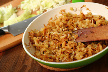 Fried Cabbage. Making. Ready to eat.