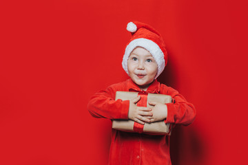 little boy holding christmas gift