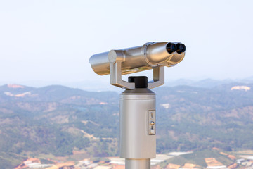 tourist binoculars aimed at the mountain scenery of Vietnam