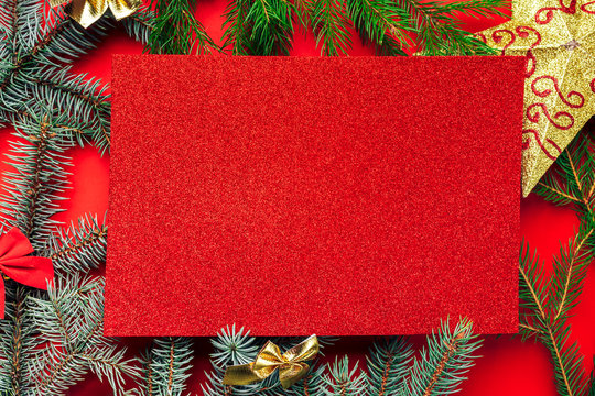 Frame of christmas decoration on red background.