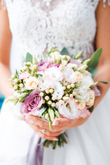 White bridal bouquet of roses and peonies. Wedding day. 