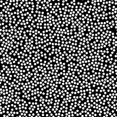 Random scattered polka dot pattern, abstract black and white background, white dots on black.