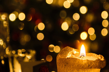 Christmas candle against colorful blur background