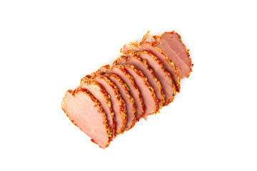 Slices of smoked beef in spices close-up. Smoked tenderloin cut into slices close-up.