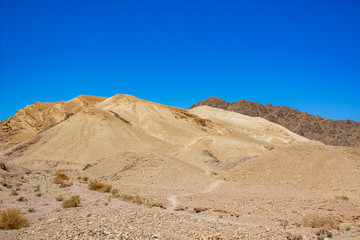 Fototapeta na wymiar desert dry and warm scenic landscape sand stone rocky hills view in clear day weather time 