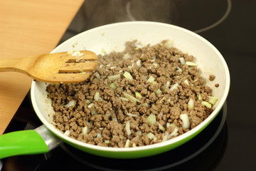 Pan frying ground beef with onion and garlic