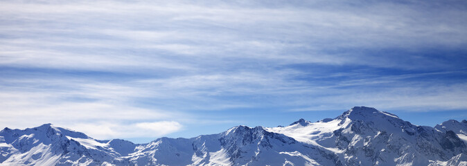 Fototapeta na wymiar Sunlight snowy mountains in wind morning