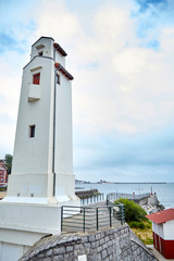 White lighthouse in Saint-Jean-de-Luz, Basque Country, France. European coastal town on the shore of the Bay of Biscay