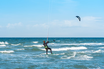 Kiteboarder in the Baltic Sea at the beach of Flügge on the island of Fehmarn in the north of...