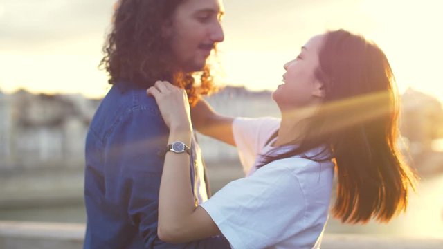 Couple hugging at sunset in Paris, France