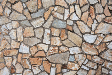 Texture of a stone wall. Old castle stone wall background. Wall made of wild stone. Natural background.