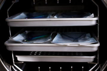 Sterilizing medical instruments in autoclave. Equipment for sterile cleaning of working medical...