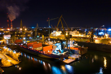 Beautiful night panorama ships in to dry docks. Poland Gdansk, drone footage, natural light.