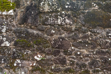 Texture of a stone wall. Old castle stone wall background. Wall made of wild stone. Natural background.