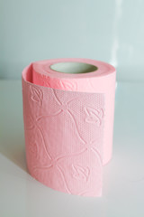 roll of colored toilet paper in the foreground