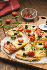 Pizza with wine tomatoes cheese and arugula