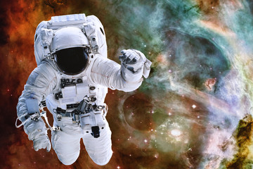 Fototapeta na wymiar Astronaut somewhere in deep space. Elements of this image were furnished by NASA