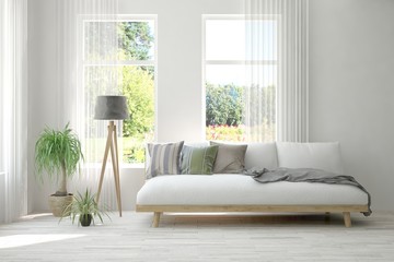 Stylish room in white color with sofa and summer landscape in window. Scandinavian interior design. 3D illustration