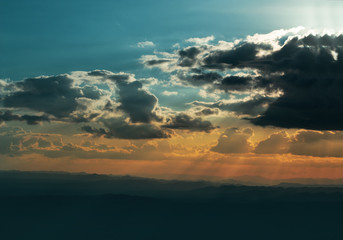 summer evening of weather climate nature sky cloudscape with sunset light and moutain forest background