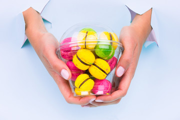 Colored, bright, sweet macaroons on a blue background. 
