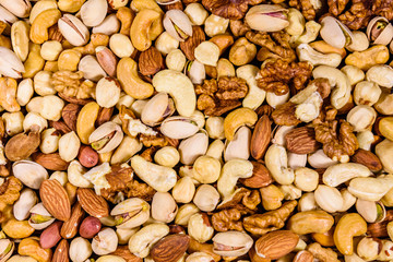 Background of the various nuts (almond, cashew, hazelnut, pistachio, walnut). Vegetarian meal. Healthy eating concept