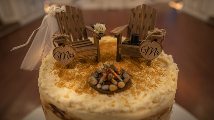 Camping adirondack chairs cake topper for a wedding cake