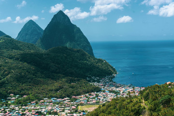two pitons with village and ocean
