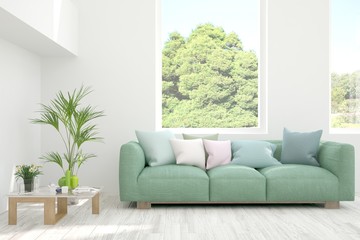 Stylish room in white color with sofa and summer landscape in window. Scandinavian interior design. 3D illustration