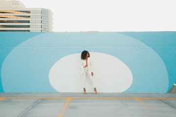 Female model in white suit posing