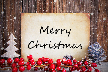 Paper With English Text Merry Christmas. Christmas Decoration And Wooden Background With Snow