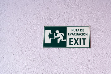 Bilingual Sign in Spanish and English -  Ruta De Evacuacion and Exit 