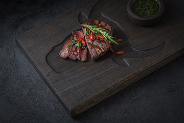 Sliced medium rare beef steak, copy space