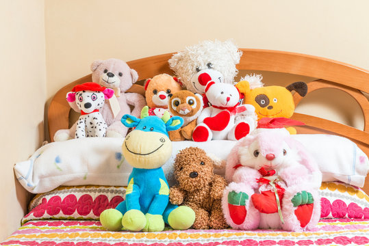 Cuddly toys on a bed