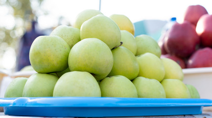 Apples on the counter for sale