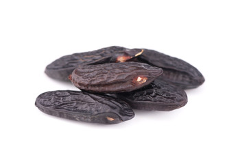 Tonka beans isolated on white background. Bean of Dipteryx odorata, cumaru or kumaru. Fresh aroma tonka beans.