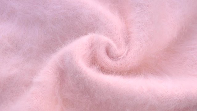 Soft fluffy jersey rotates. Soft Wool background.