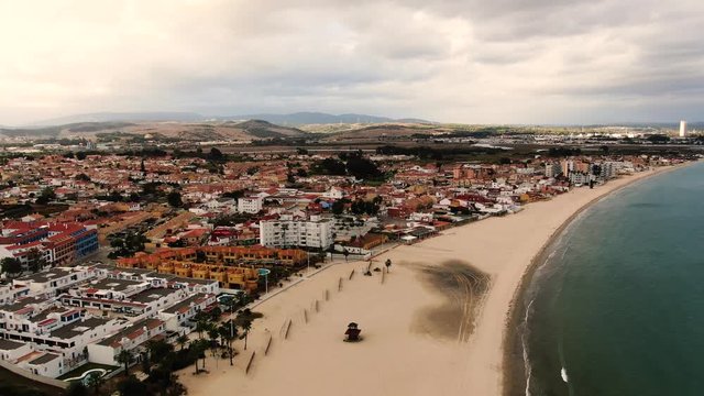 Aerial view of Algeciras city. Beach of the city and buildings.