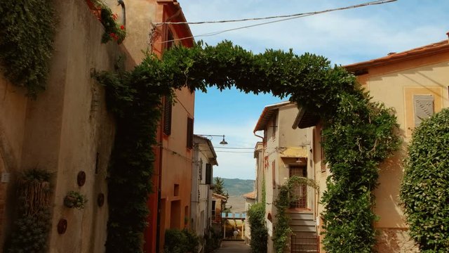 Walking along picturesque houses in the medieval town Lajatico, Tuscany, Italy, the home town of tenor Andrea Bocelli