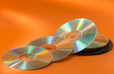 cd discs, on orange background