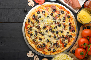 Flat lay of italian pizza and ingredients. Pizzeria, restaurant, recipe book, home cooking. Horizontal photo with space for design.