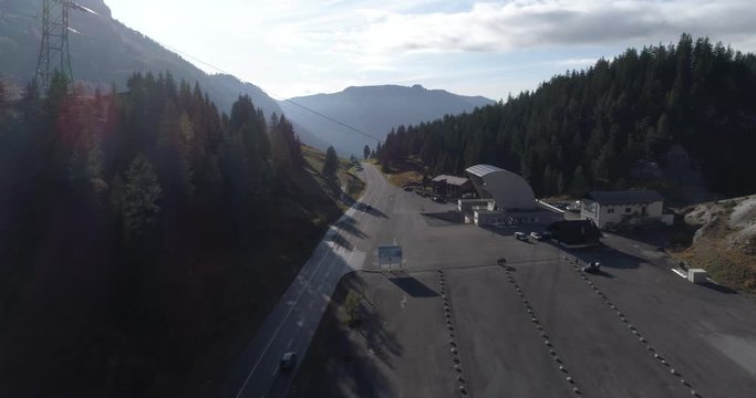 Driving on Pillon pass in autumn - Aerial 4K