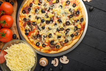 Flat lay of italian pizza and ingredients. Pizzeria, restaurant, recipe book, home cooking. Horizontal photo with space for design.