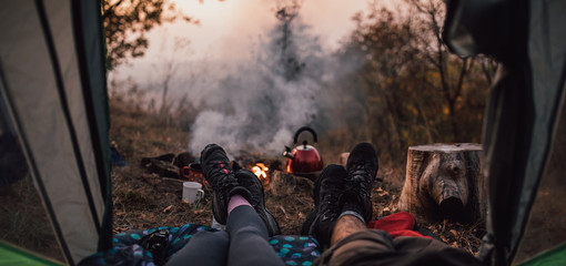 Young couple hanging out at campsite