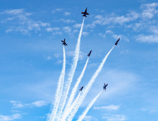 airplane flying in the sky, smoke trails, and formations