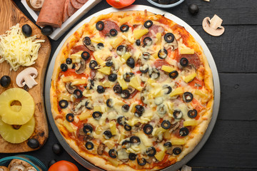 Italian pizza and ingredients. Pizzeria, restaurant, recipe book, home cooking. Horizontal photo with space for design.